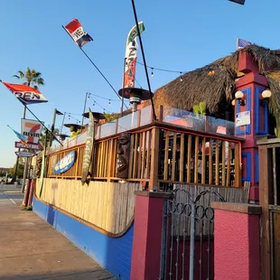 a tiki hut with a thatched roof