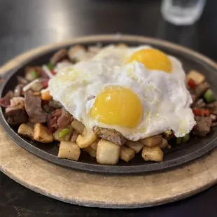 a fried egg and hash browns