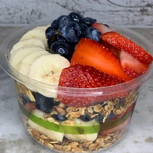 a bowl of fruit and granola