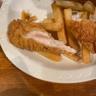 a plate of fried chicken and french fries