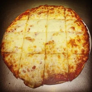 a cheese pizza cut into squares