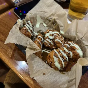 a basket of food and a glass of beer