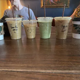 Left to right - Ethiopian Drip, Vanilla Latte, Oat Milk Latte, Frozen Strawberry Fields, Midnight Grandma, Prague Mocha