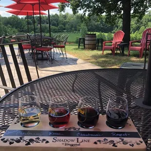 three glasses of wine on a table