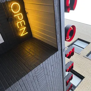 a neon sign for a coffee shop