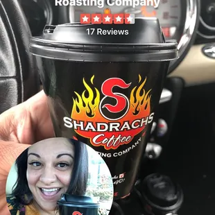 a woman holding a cup of coffee