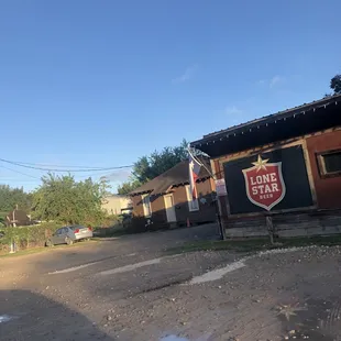 a lone star sign on the side of a building