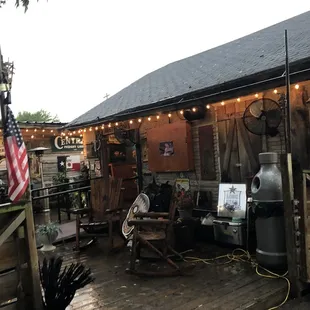 a patio area with a grill, grilling area, and american flag