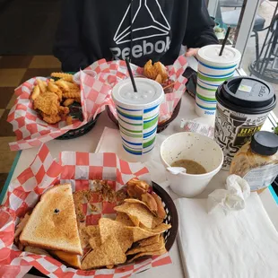 a person sitting at a table with food