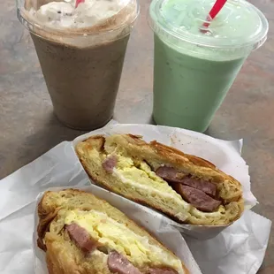 Drinks: Java chip with whipped cream and green tea Sandwich: sausage, egg, and cheese croissant