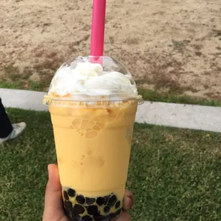 Mango smoothie with boba.