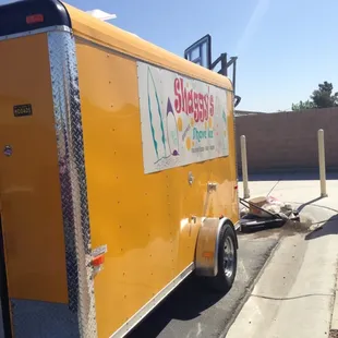 a trailer parked on the side of the road