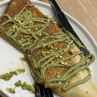 Half eaten pistachio crêpe