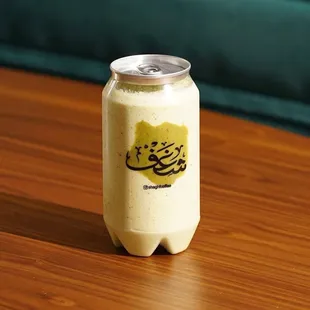 a drink in a can on a table