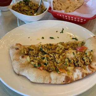 Scrambled spicy eggs with Indian bread - naan