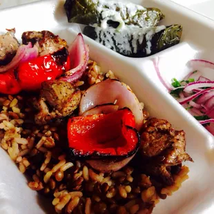 Lamb Kebab over Lentil rice with a side of Dolma..!!! Keep getting spoiled..!!!