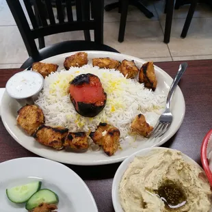 Chicken kebob with butter, safron rice, and roasted romato