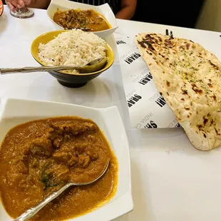 a plate of food and a glass of water