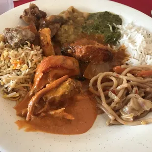 Buffet plate #1! Chicken masala, goat biriyani, veggie lo mein, creamy spinach, chickpeas and cauliflower