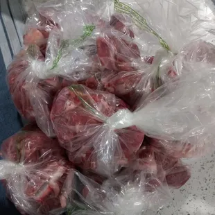 a pile of meat wrapped in plastic