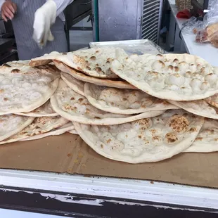 Iraqi bread fresh out of the tanoor.