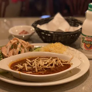 a bowl of soup and a plate of rice