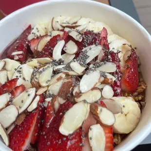 a bowl of strawberries and almonds