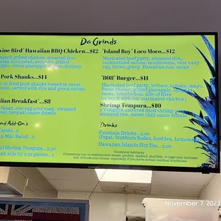 a menu on a large screen in a restaurant