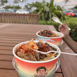 two bowls of food on a table