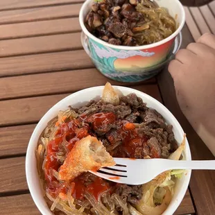 a person eating a bowl of food