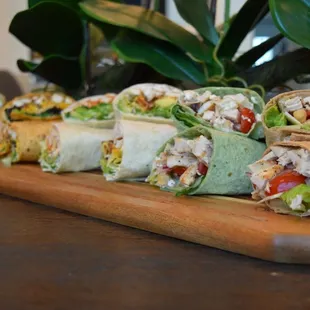 ows a variety of wraps on a cutting board