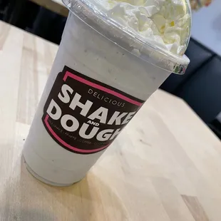 a cup of milkshake with whipped cream