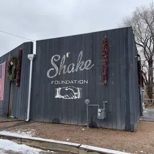 shake foundation painted on the side of a building