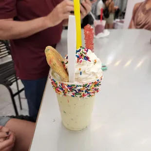 an ice cream sundae with sprinkles
