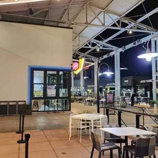 Tons of seating! Much more than visible here (are around corner).
 
 Some are by outdoor heaters, and some are by an elevated fire pit.