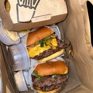 three hamburgers in a cardboard box