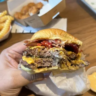 Double cheeseburger with red peppers and bacon