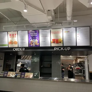 menus on the wall above the counter