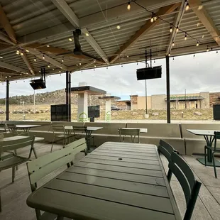 Outdoor dining area with view of I-25 in the background.