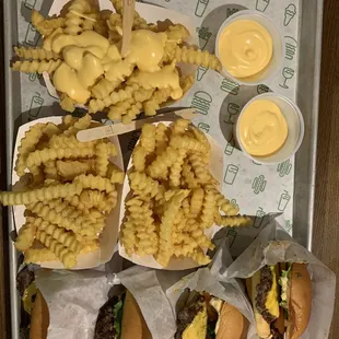 a tray of fries and cheeseburger