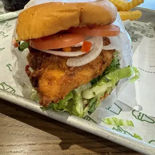 Fried chicken sandwich.  Add sliced raw onion.