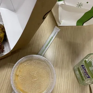 a cup of coffee and a box of donuts