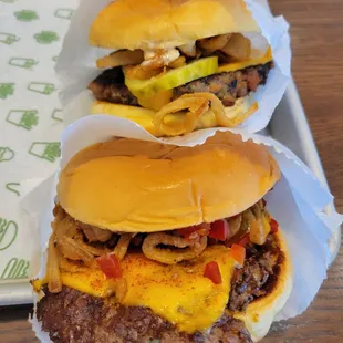 two burgers on a tray