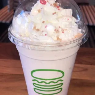 Strawberry Rhubarb Shake Real strawberry and rhubarb hand-spun with vanilla frozen custard, topped with whipped cream &amp; shortbread streusel.