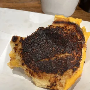 Burnt grill cheese sandwich (one bite taken out of it), and you can see how small it is.