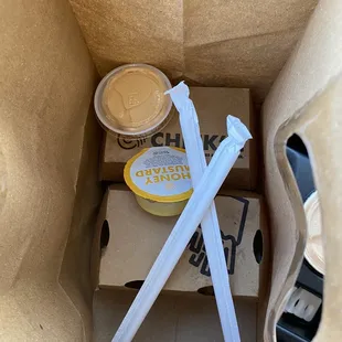 two straws in a paper bag