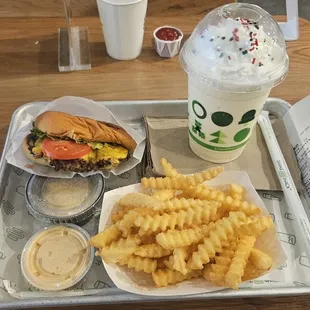My standard order. Shake Shack Burger, regular fries, and a shake. Sides of Cheese sauce and Shack sauce.