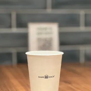 a paper cup on a table
