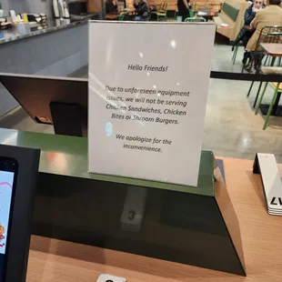 a sign on the counter at shake shack