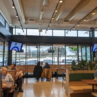 A view of the eating area with TV monitors spaced throughout the dining area.